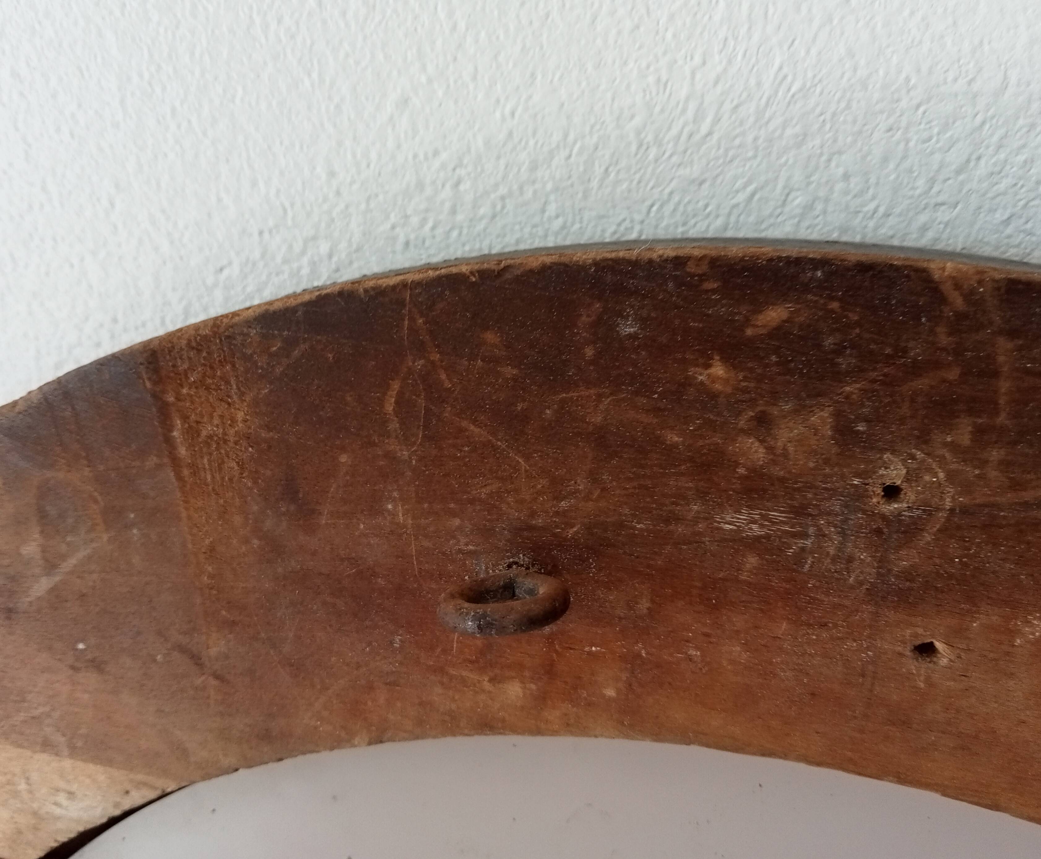 Antique round wooden mirror