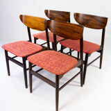 Set of four dining room chairs in rosewood and upholstered with red fabric, of danish design, 1960s