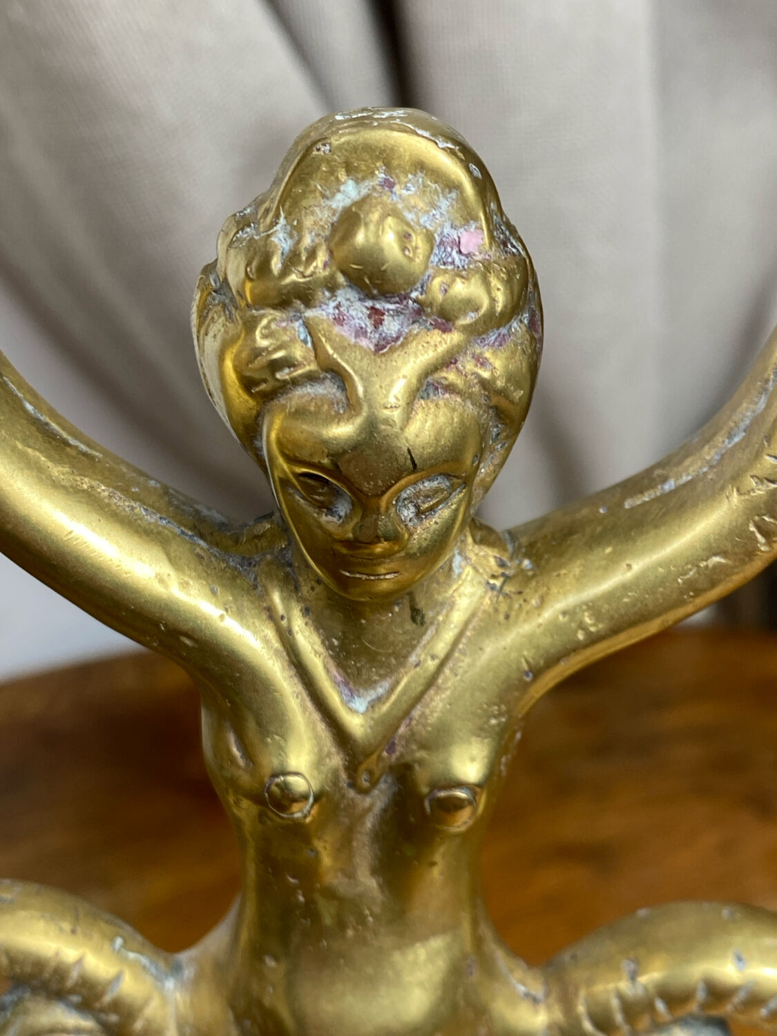 Mermaid-shaped chandelier in bronze