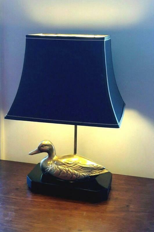 Lamp with brass duck on lacquered wood base