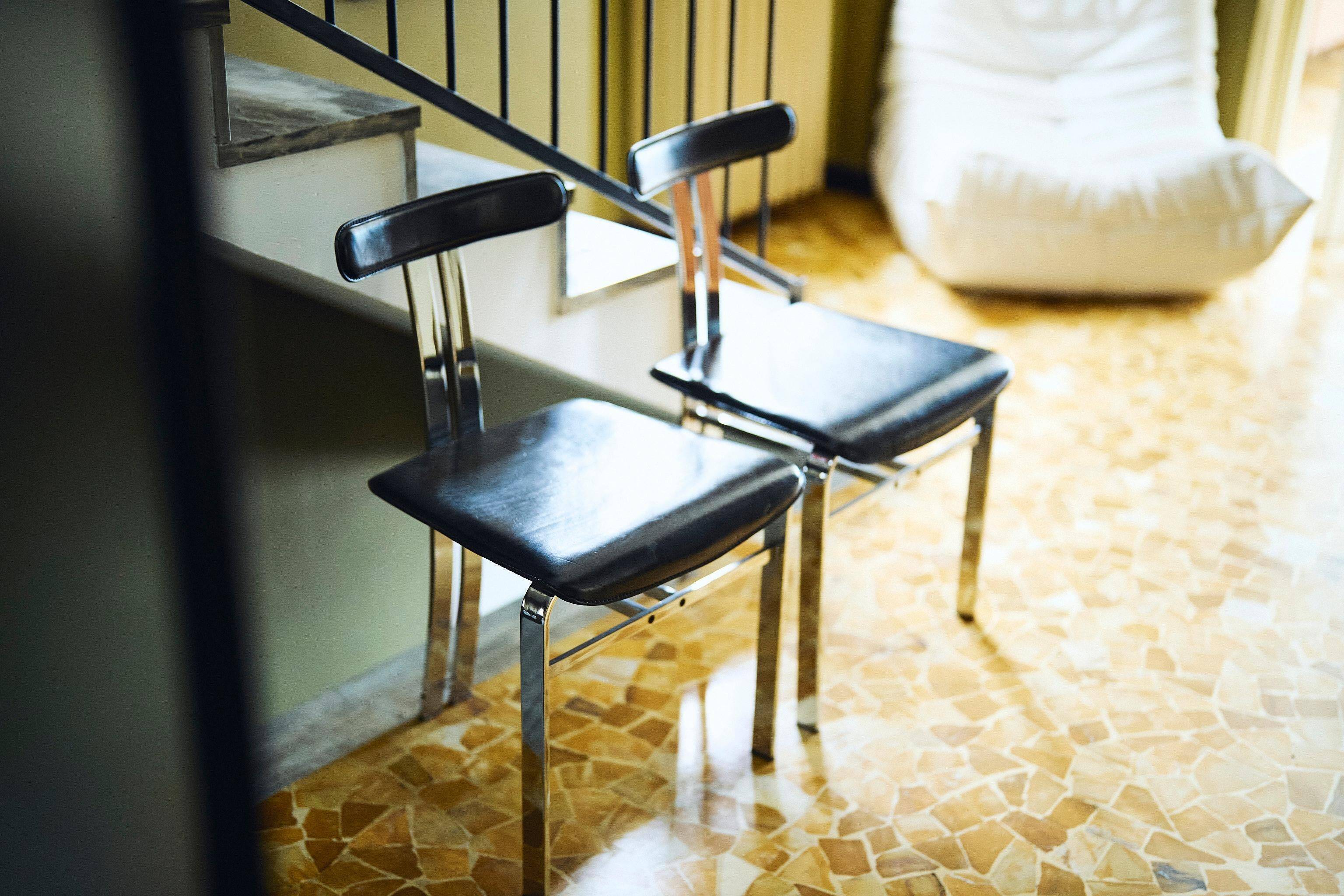 Pair of vintage Italian made dining chairs in chromed metal and black leather
