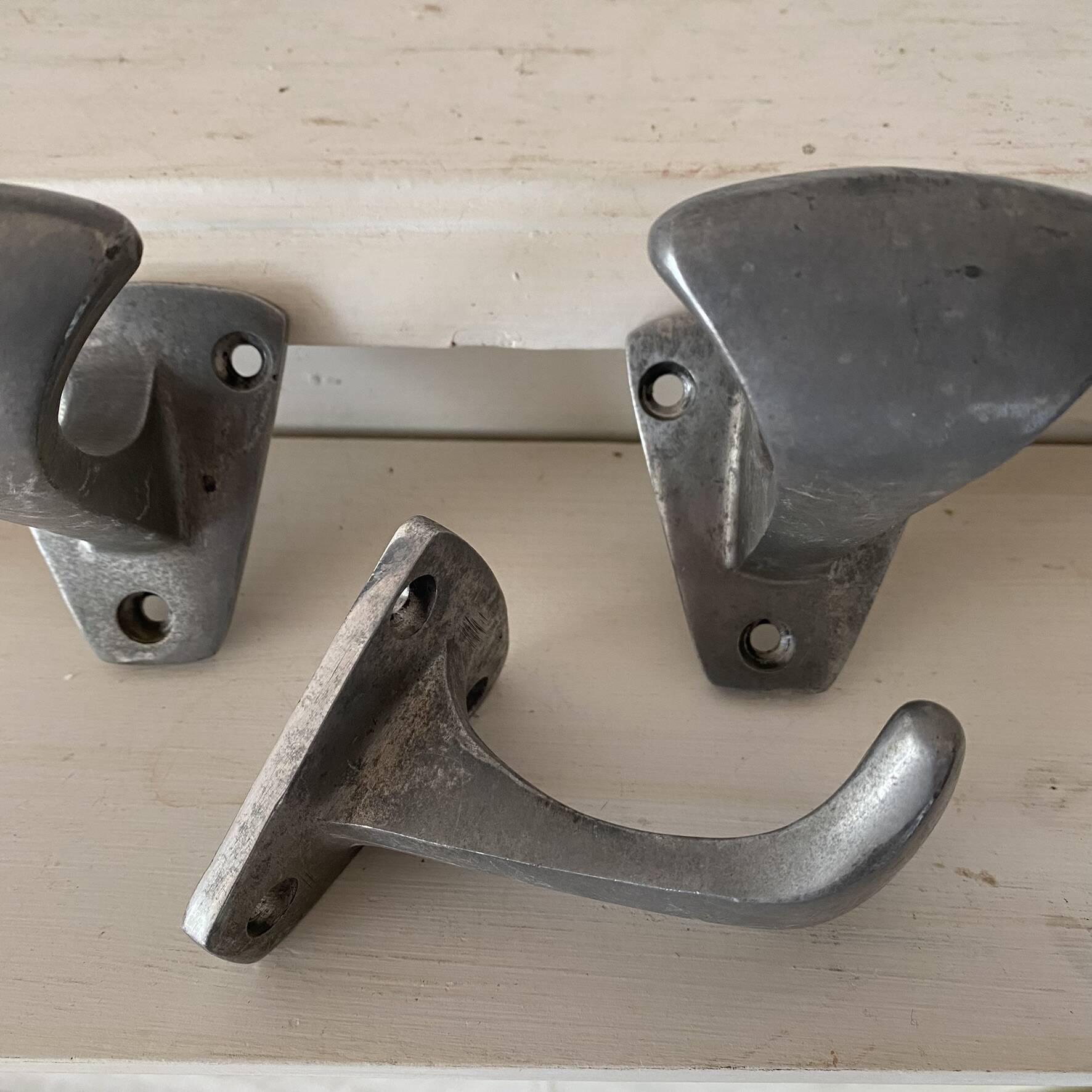 Set of 3 vintage steel hooks from a school.