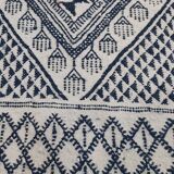 Traditional white and blue hand-woven wool carpet