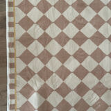 Beige checkerboard rug