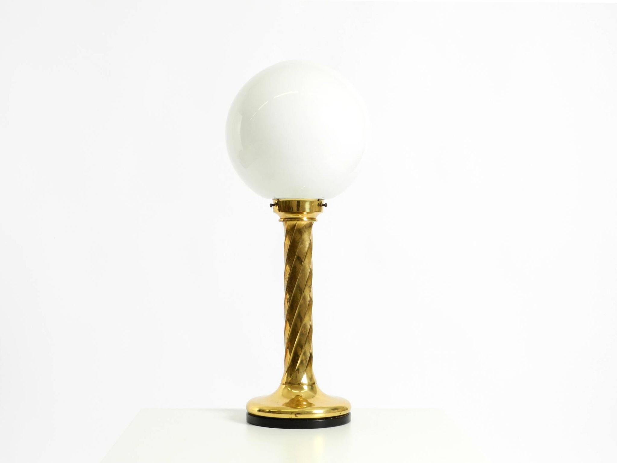 Large 1960s brass column-style table lamp with frosted glass globe