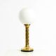 Large 1960s brass column-style table lamp with frosted glass globe