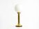 Large 1960s brass column-style table lamp with frosted glass globe