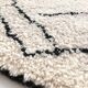 Berber rug Beni Ouarain with black graphic patterns 301x193cm