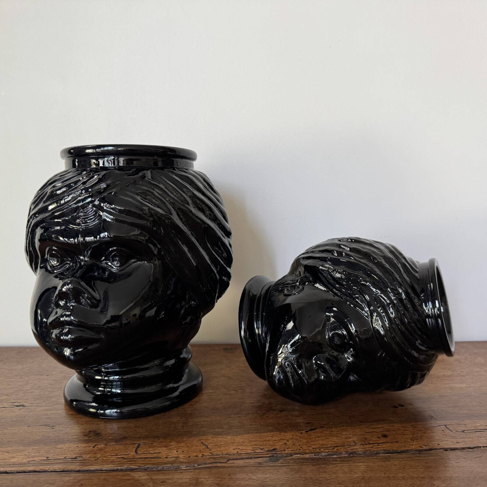 2 glass heads representing Moors