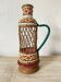 Vintage wicker and scoubidou carafe