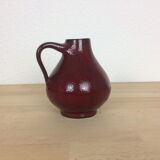 Red ceramic vase with handle