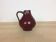 Red ceramic vase with handle