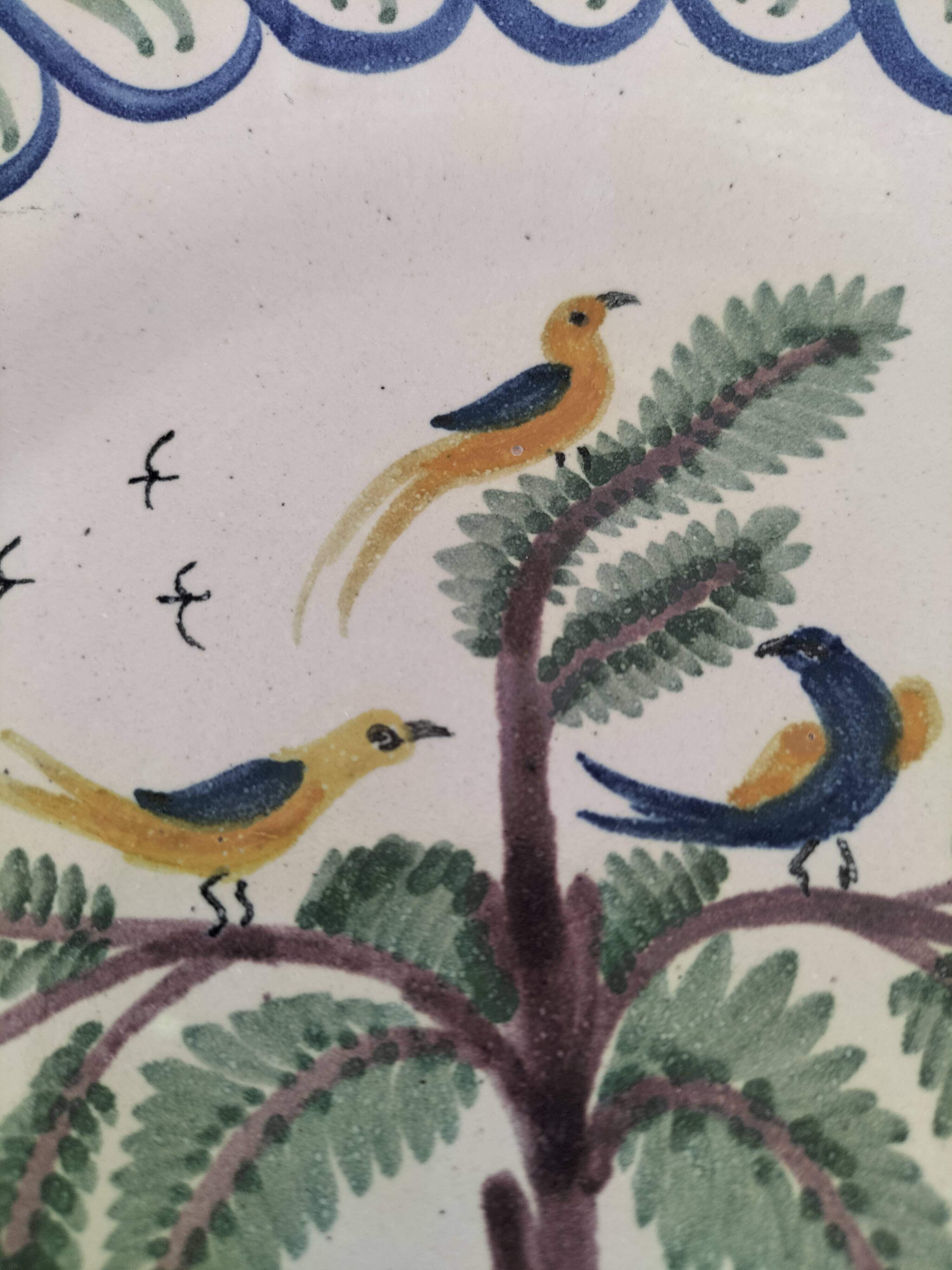 Antique hand-painted earthenware plate – piper and birds