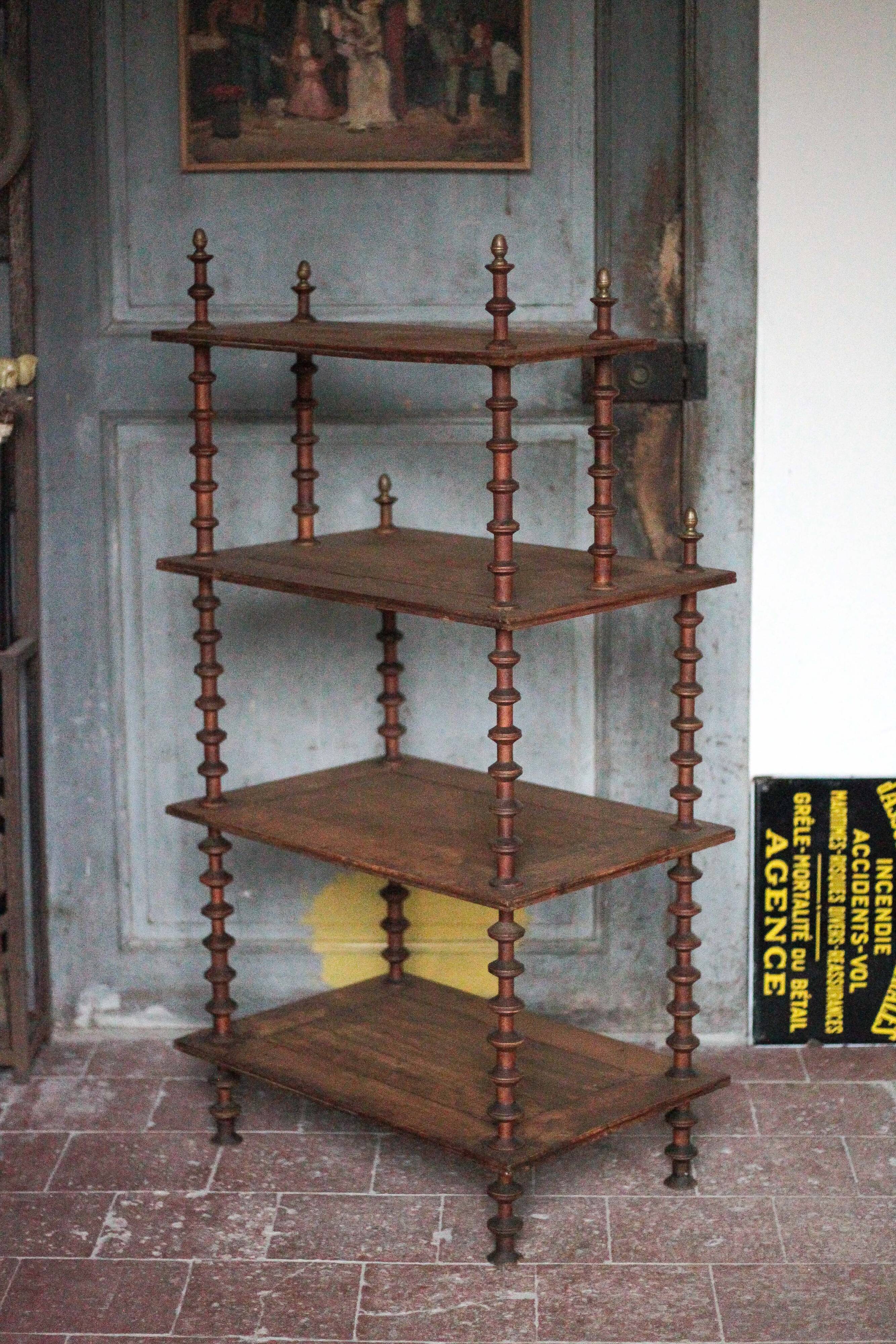 Napoleon III spool shelf, floor-standing shelf with brass tips.