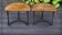 Art Deco pair of oak and wrought iron tables from the 1930s.