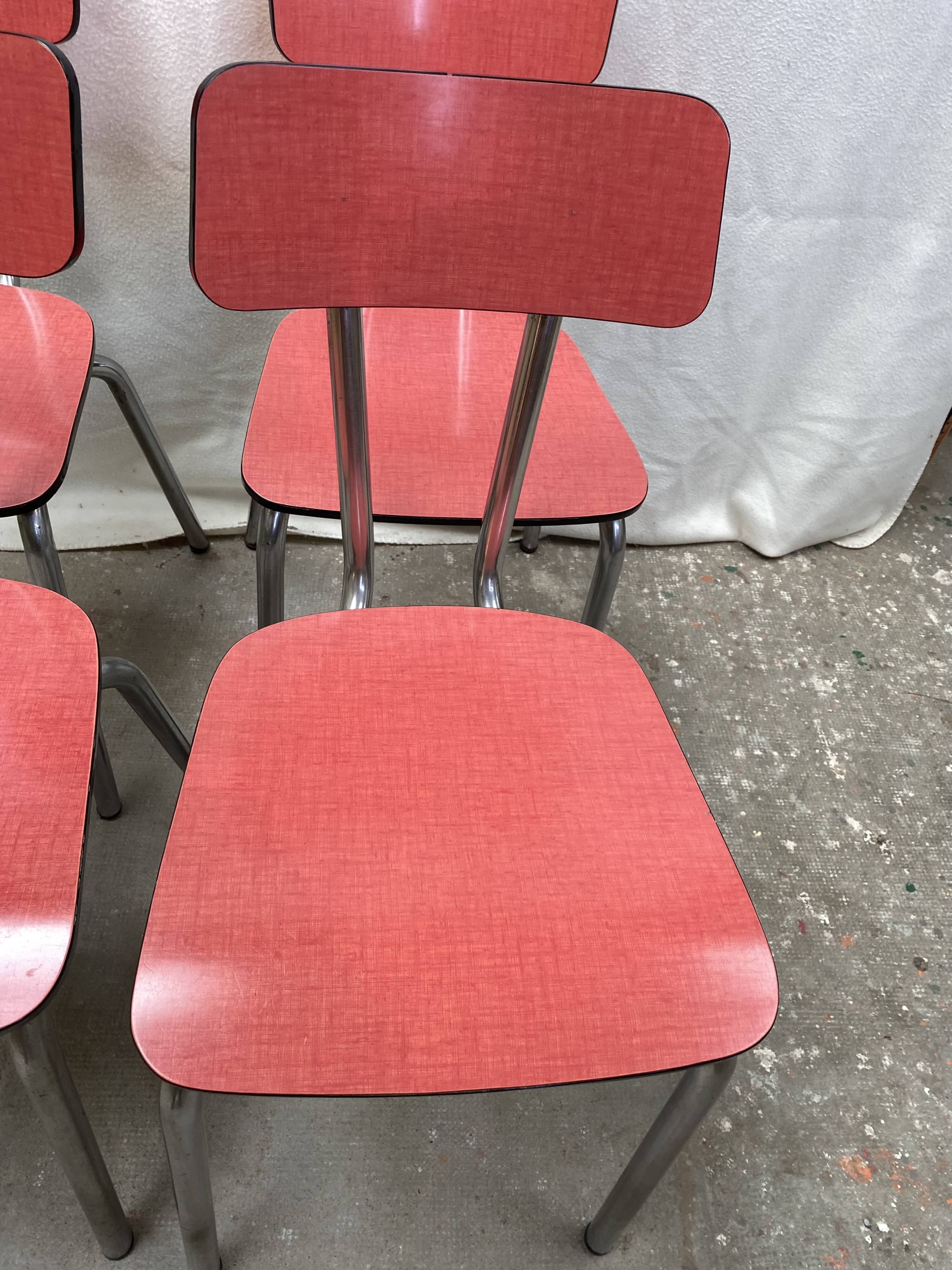 Suite of 4 red formica chairs