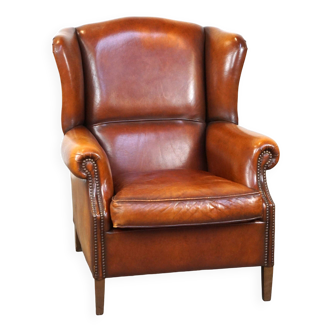 Fauteuil à oreilles en cuir de mouton marron