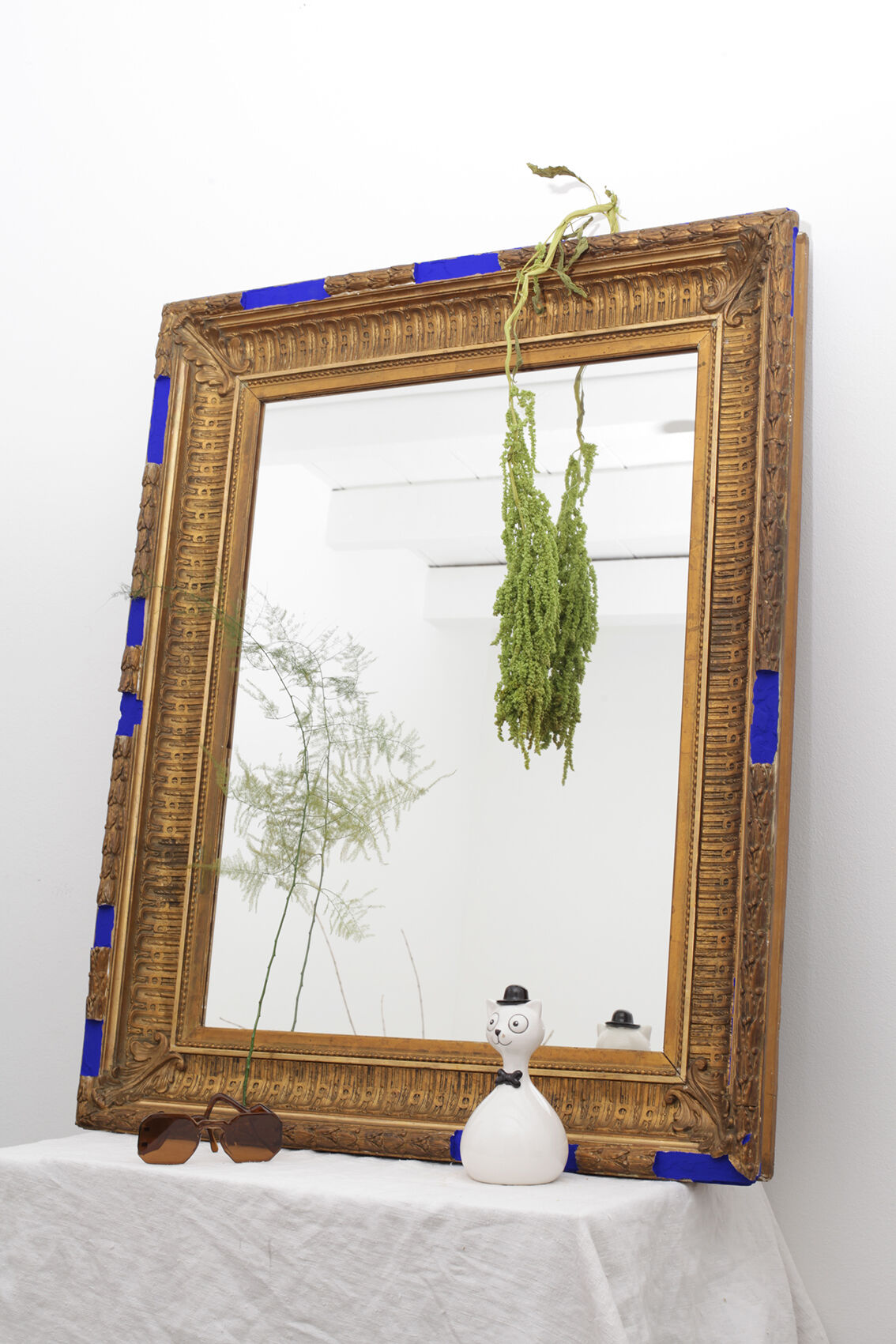 Golden antique mirror with leaf and bright king blue