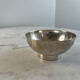 Silver-plated metal bowl — Sleek shape on a stand, modernist style
