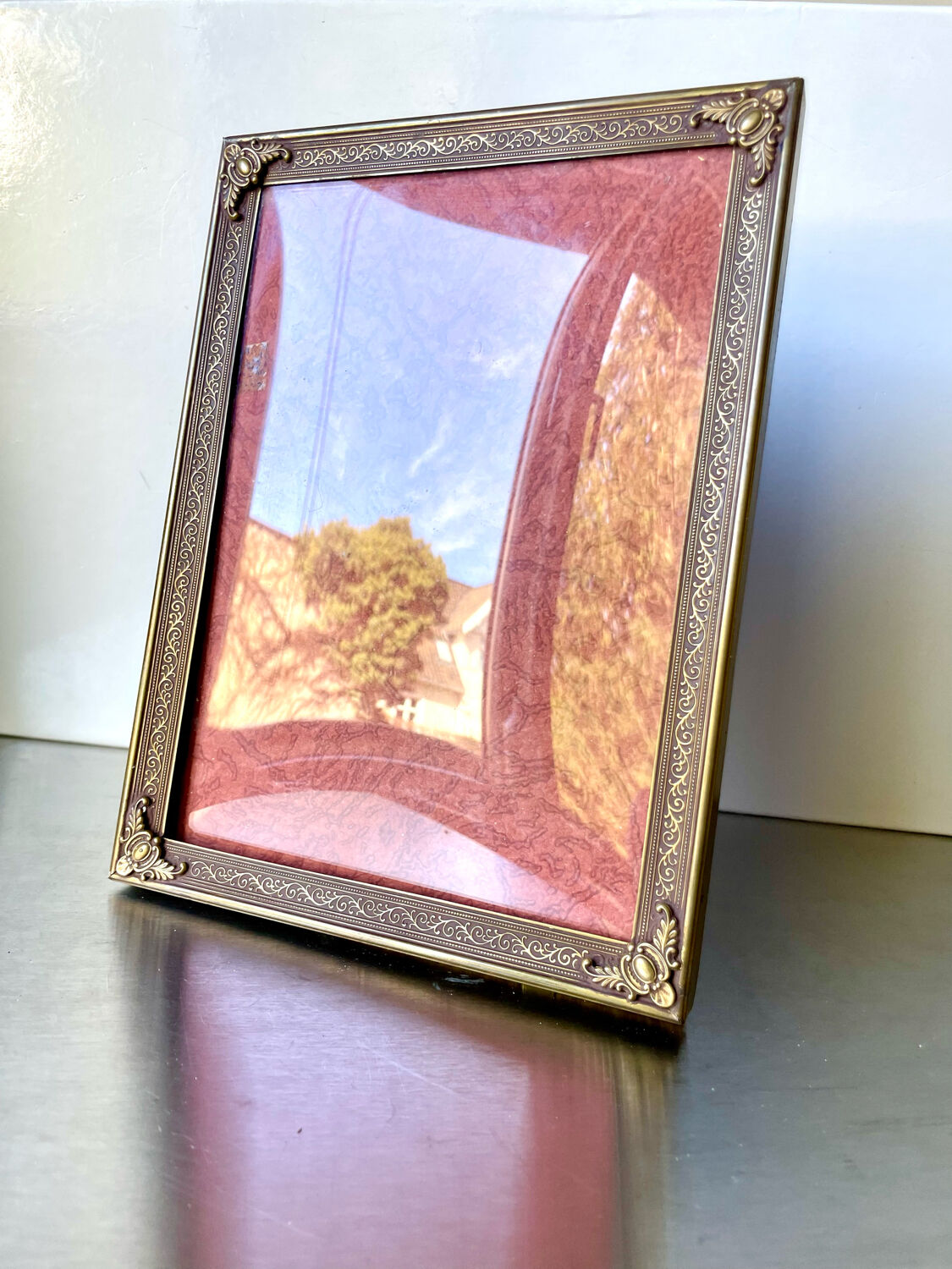 Metal frame in gold colored brass