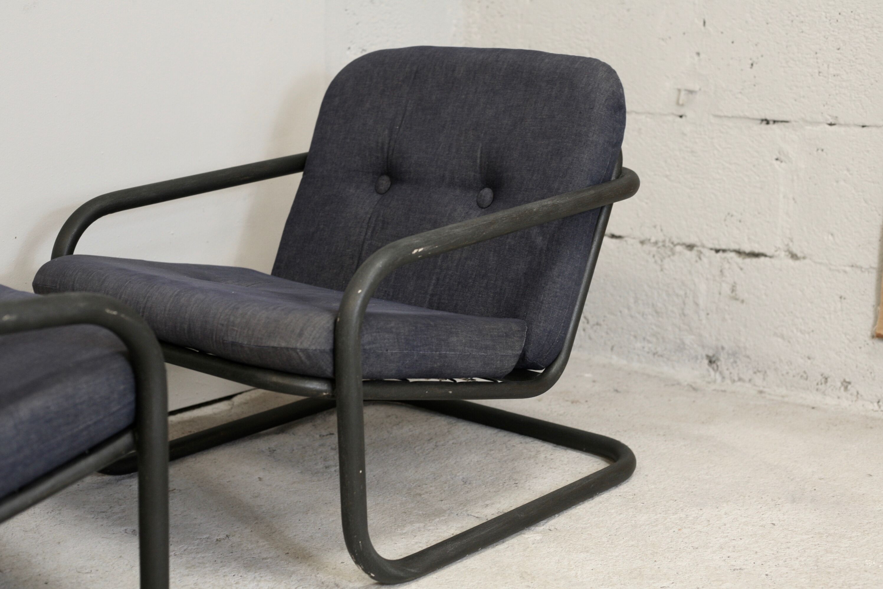 Pair of Prisunic edition armchairs, tubular steel and foam cushions, France, 1973