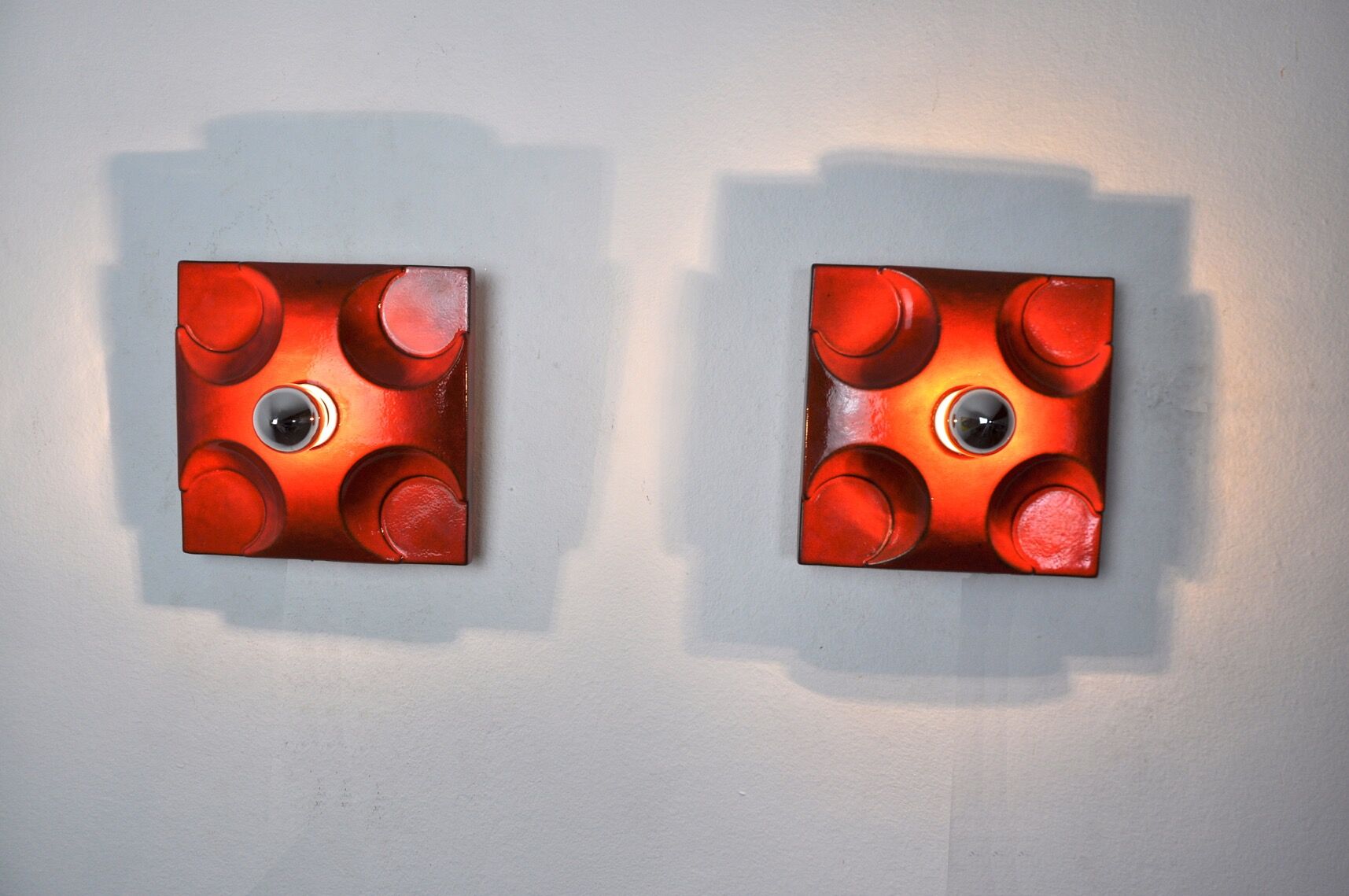 Pair of Fat Lava wall lamps by Hustadt Leuchten, Orange ceramic, Germany, 1960