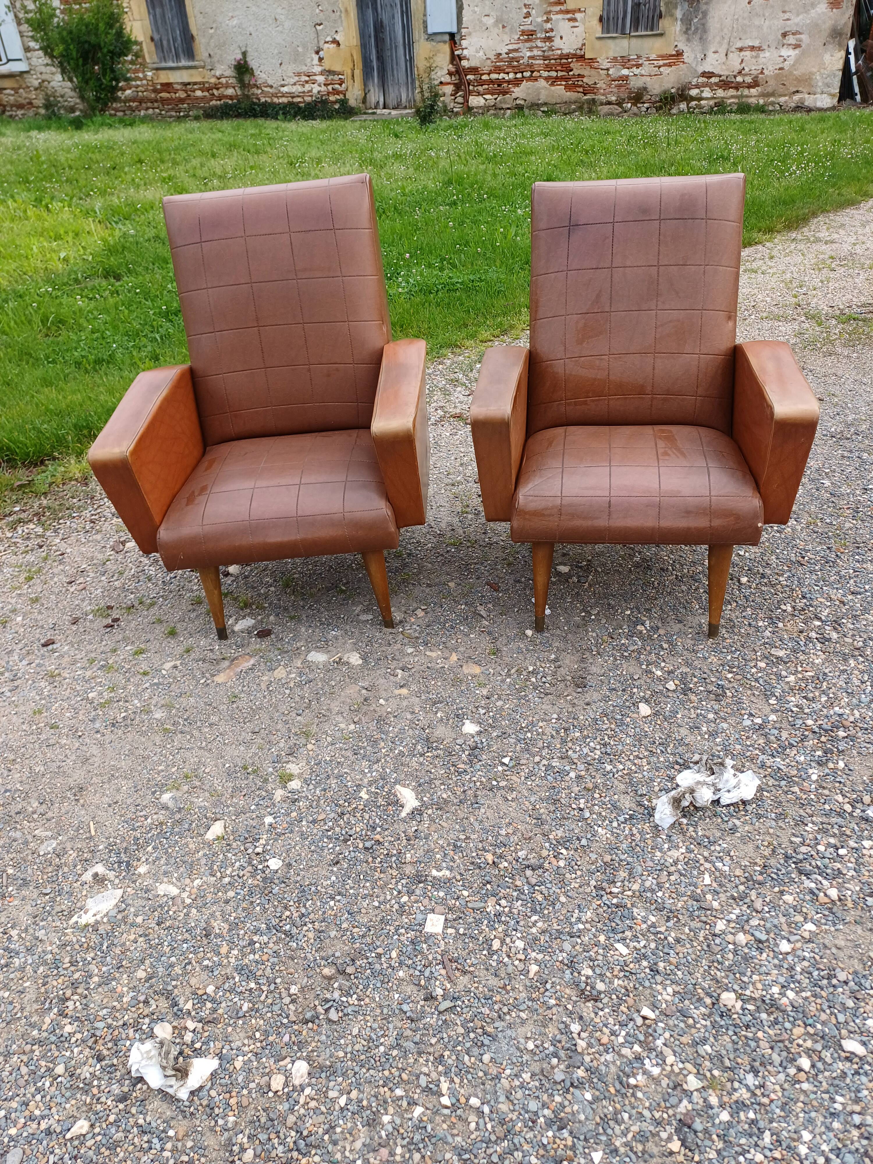 Paire de fauteuils vintage en skaï marron