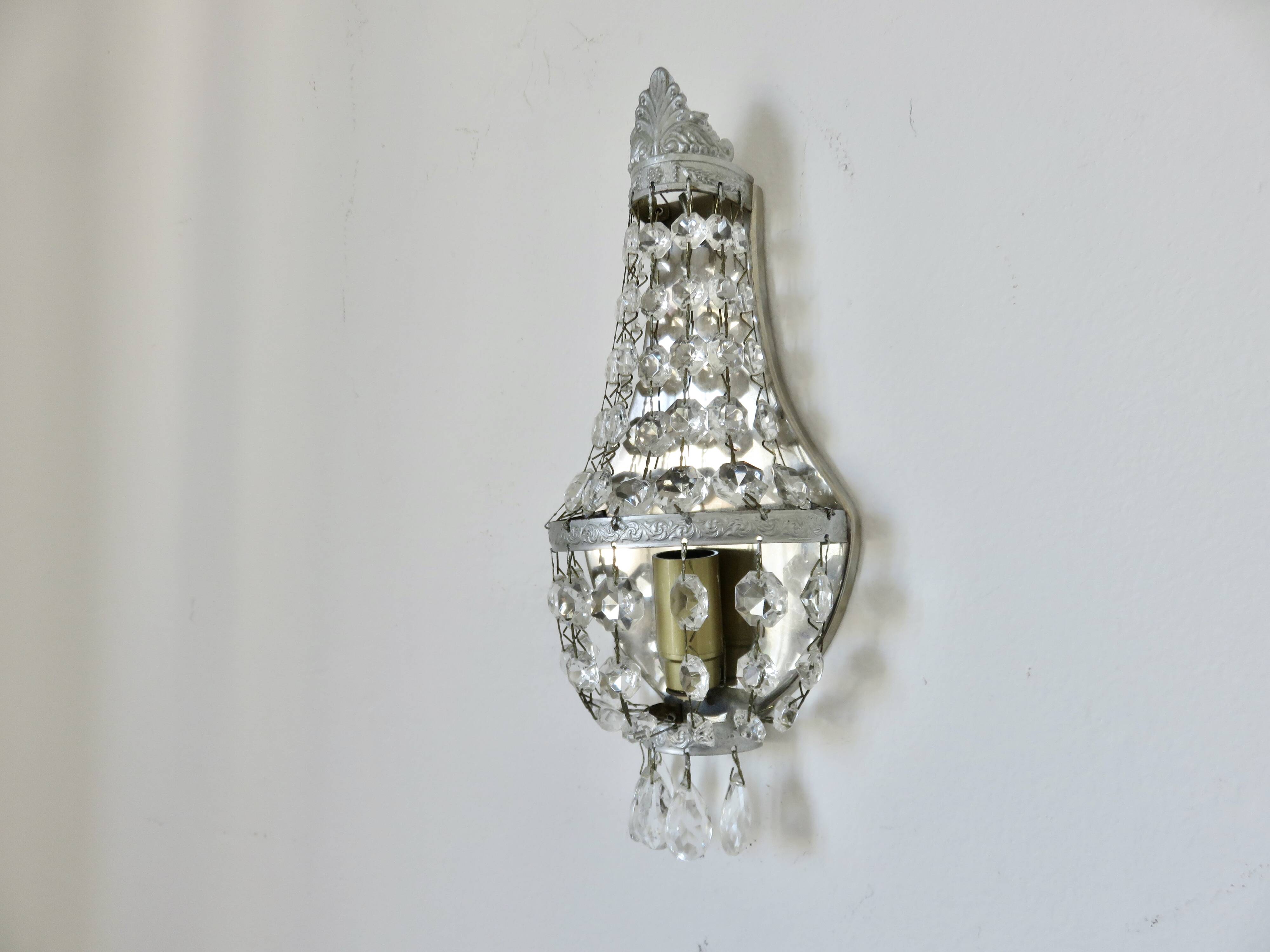 Pair of silver-plated balloon wall lights with pendants, circa 1970.