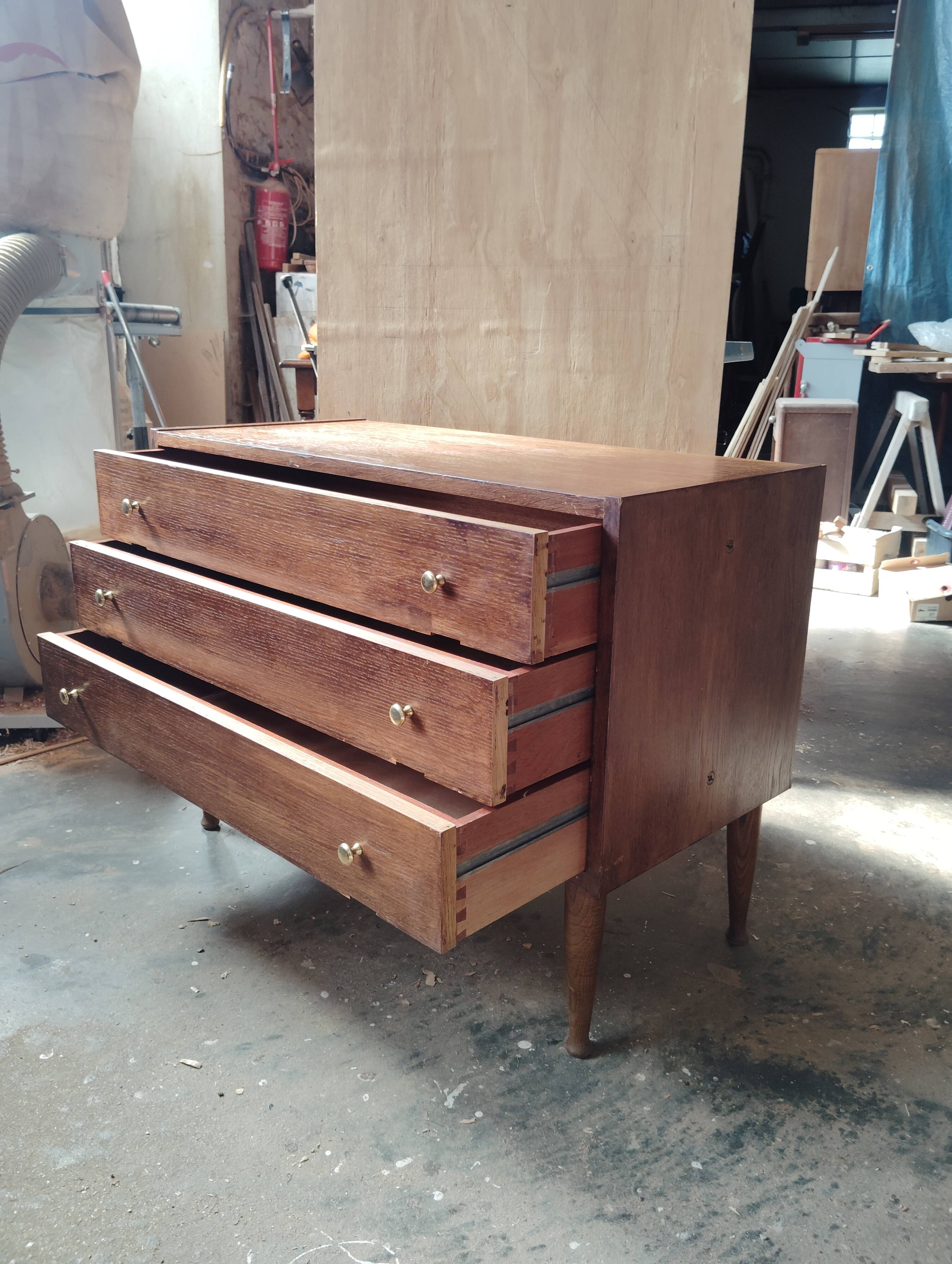 Vintage commode with tapered legs.