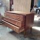 Vintage commode with tapered legs.