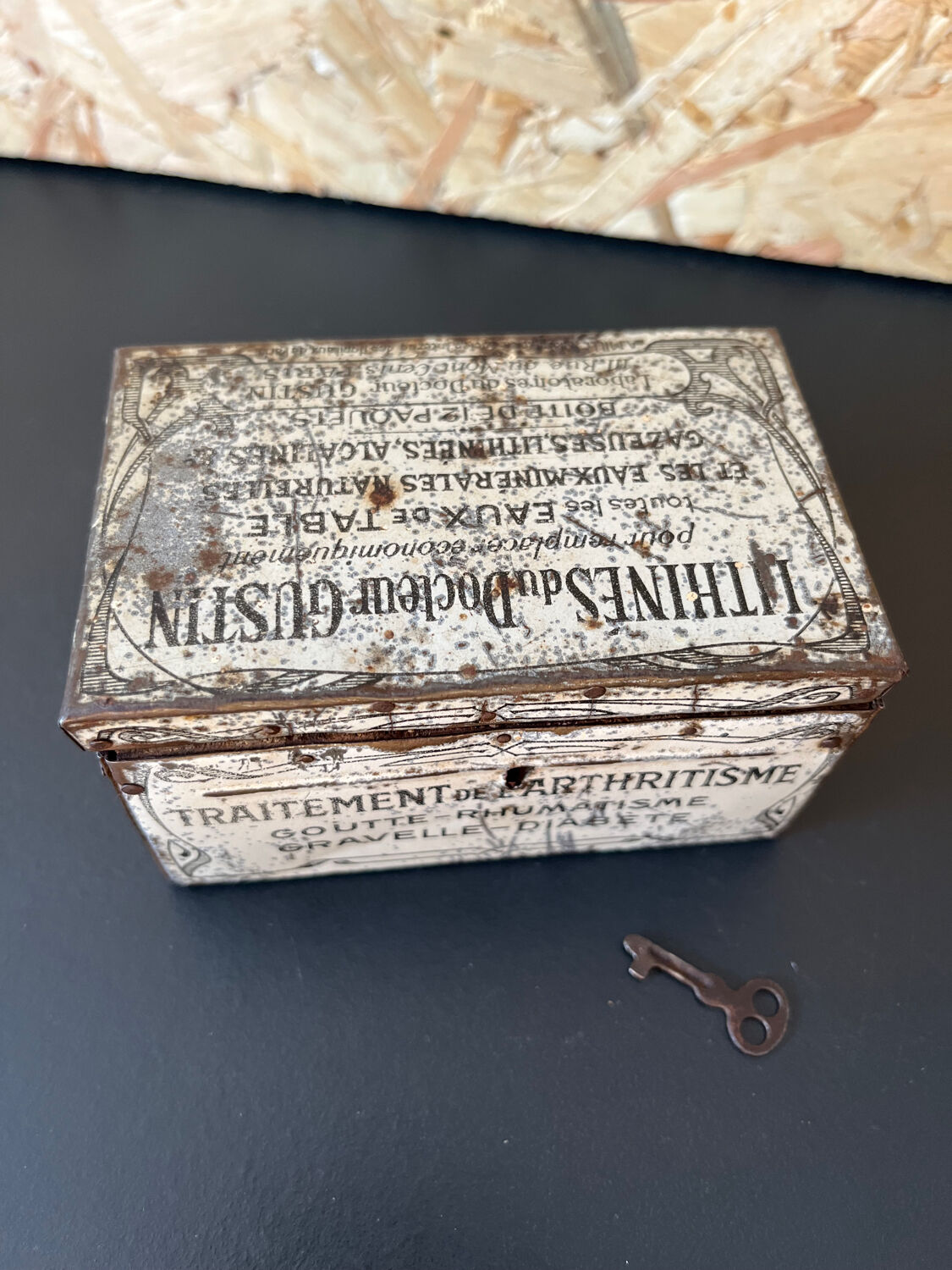 Old metal and wood medicine box with key
