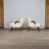 Early pair of arnold madsen clam chairs in curly sheepskin, madsen & schubell, 1944