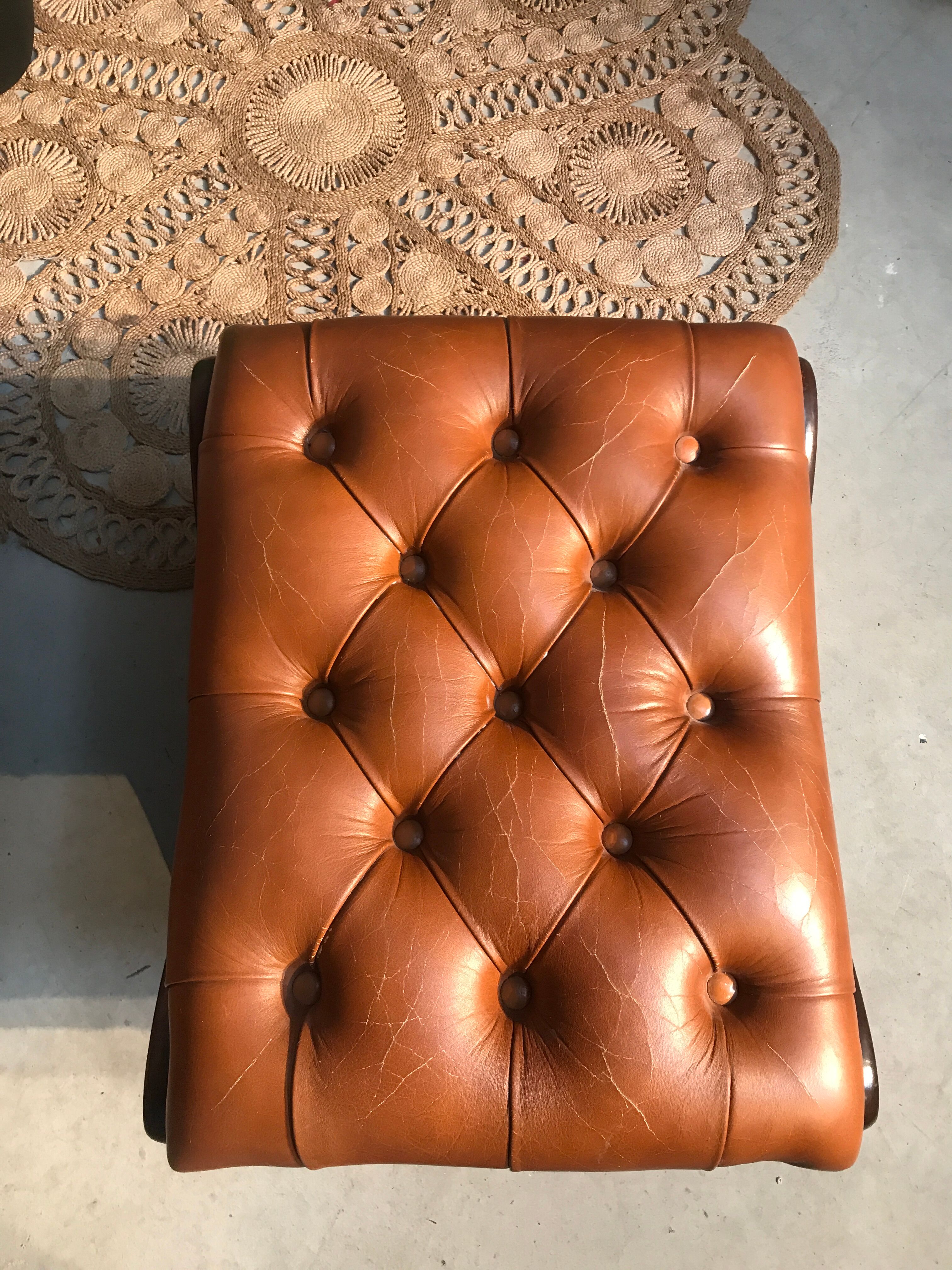 Chair padded and are resting foot.