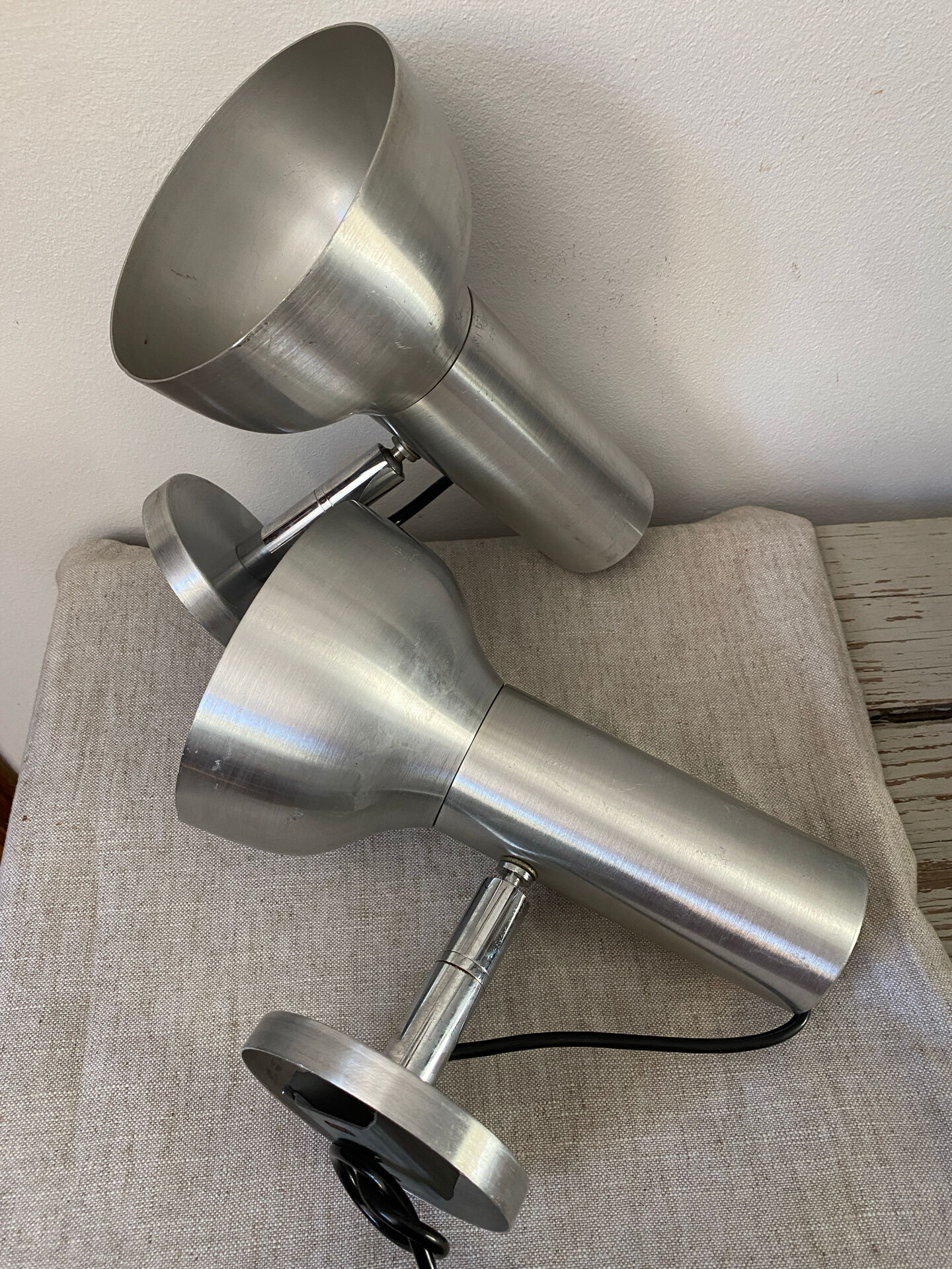 Pair of brushed metal wall sconces