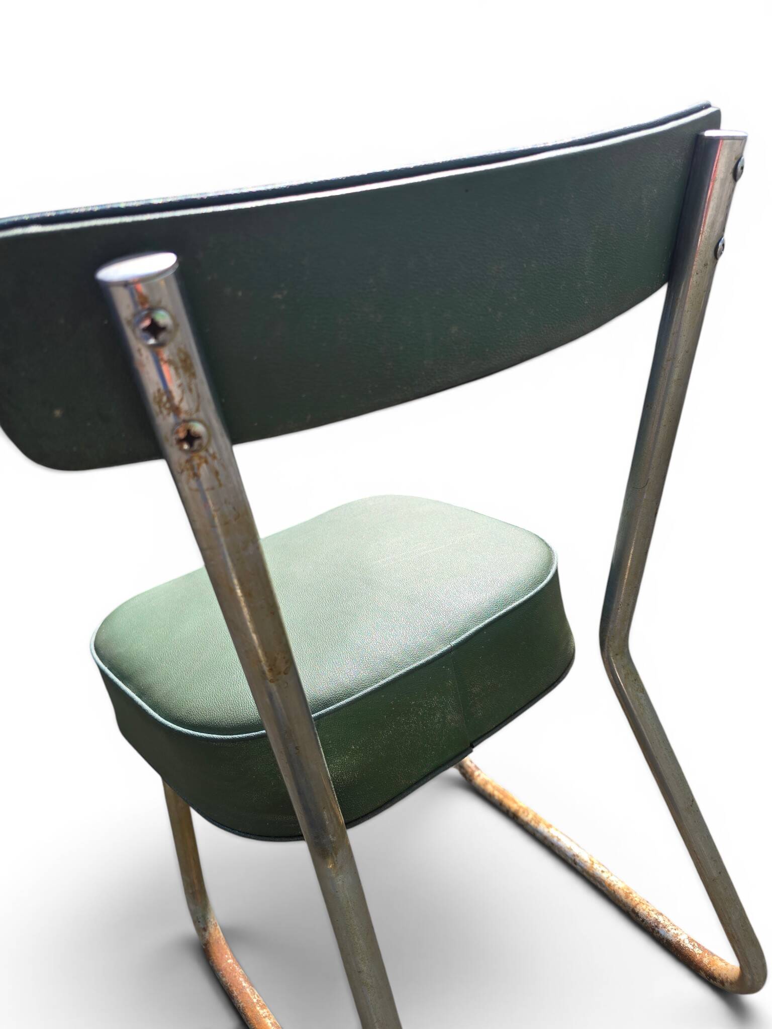 Vintage green faux leather chair with metal frame, 1960s.