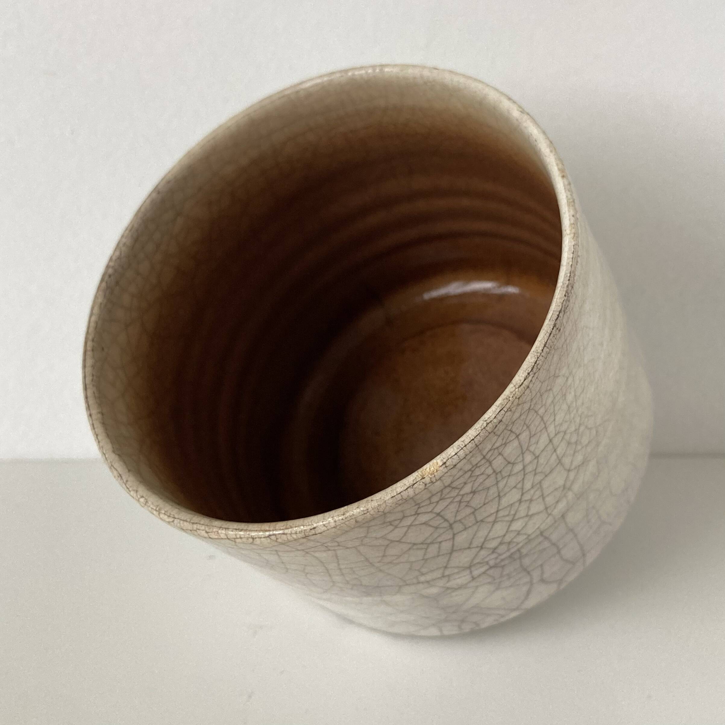 Traditional raku ceramic tea or matcha bowl with mark on the base