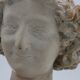 Bust in flat woman renaissance late 19th hair drapes