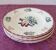 Set of 5 flat plates, signed Longwy.