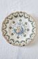 Antique plate in Moustiers faience, hand-painted, decorated with an s