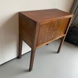 Old wooden cabinet with extendable doors