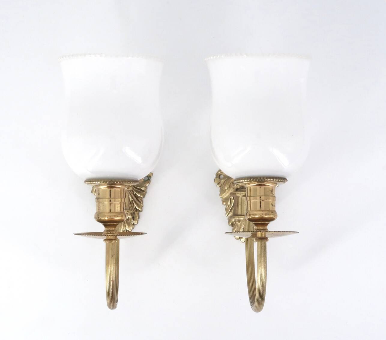 Pair of brass and opaque glass wall lights, 1950s