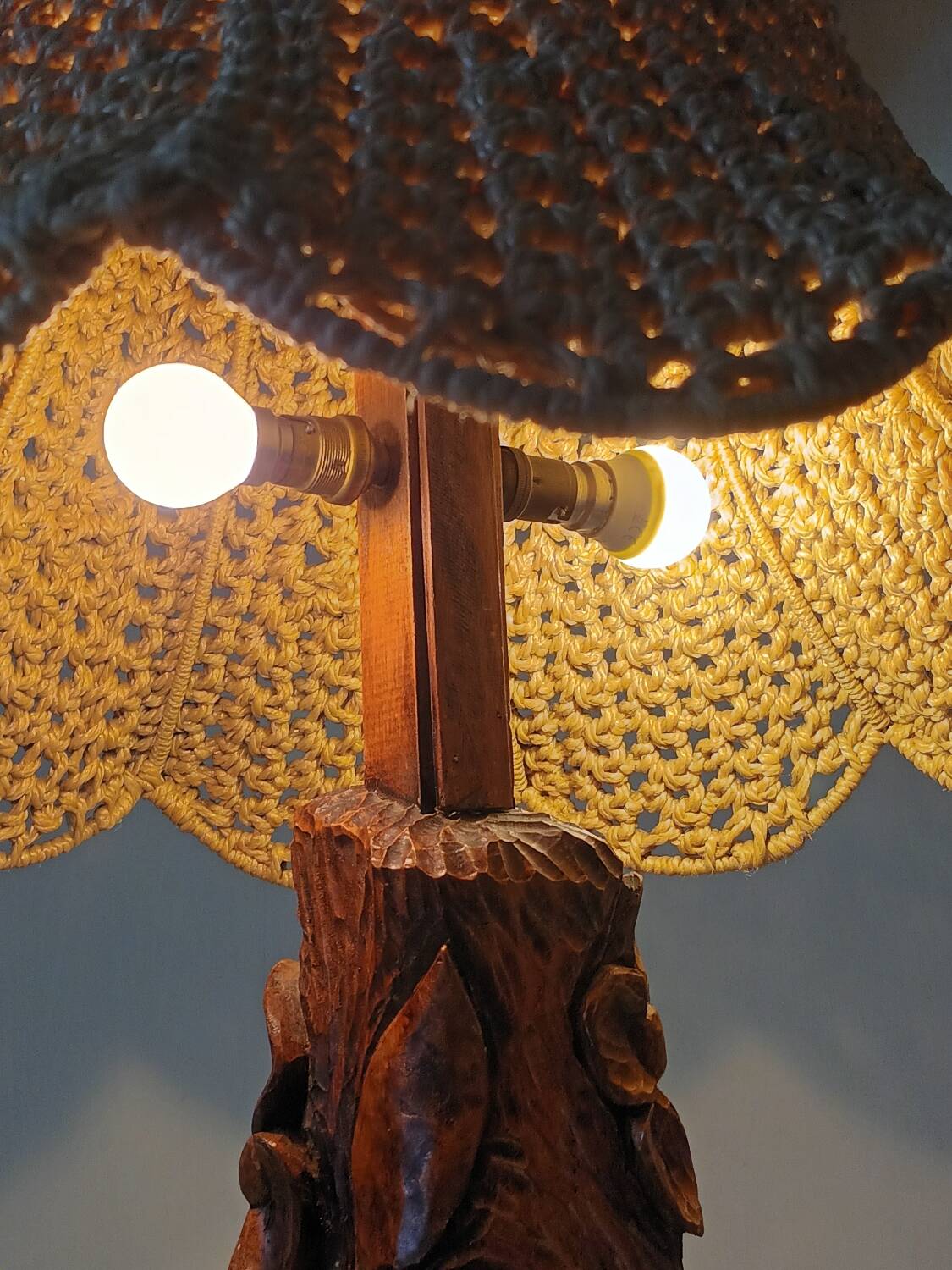 Sculpted wooden table lamp with vintage cord