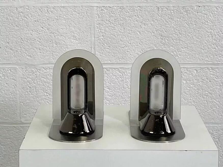 Pair of vintage stainless steel and glass wall lights