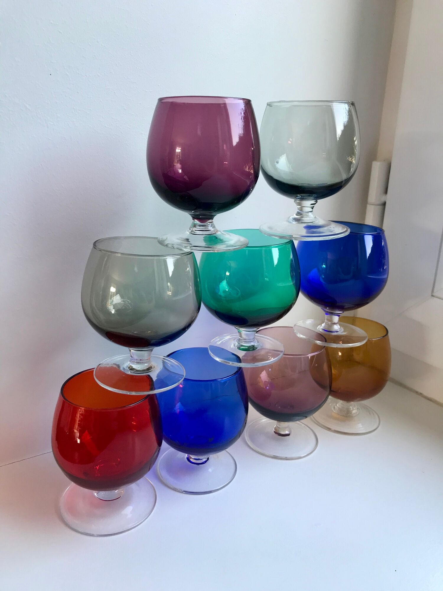 Set of 9 glasses with colored feet in blown glass 50s