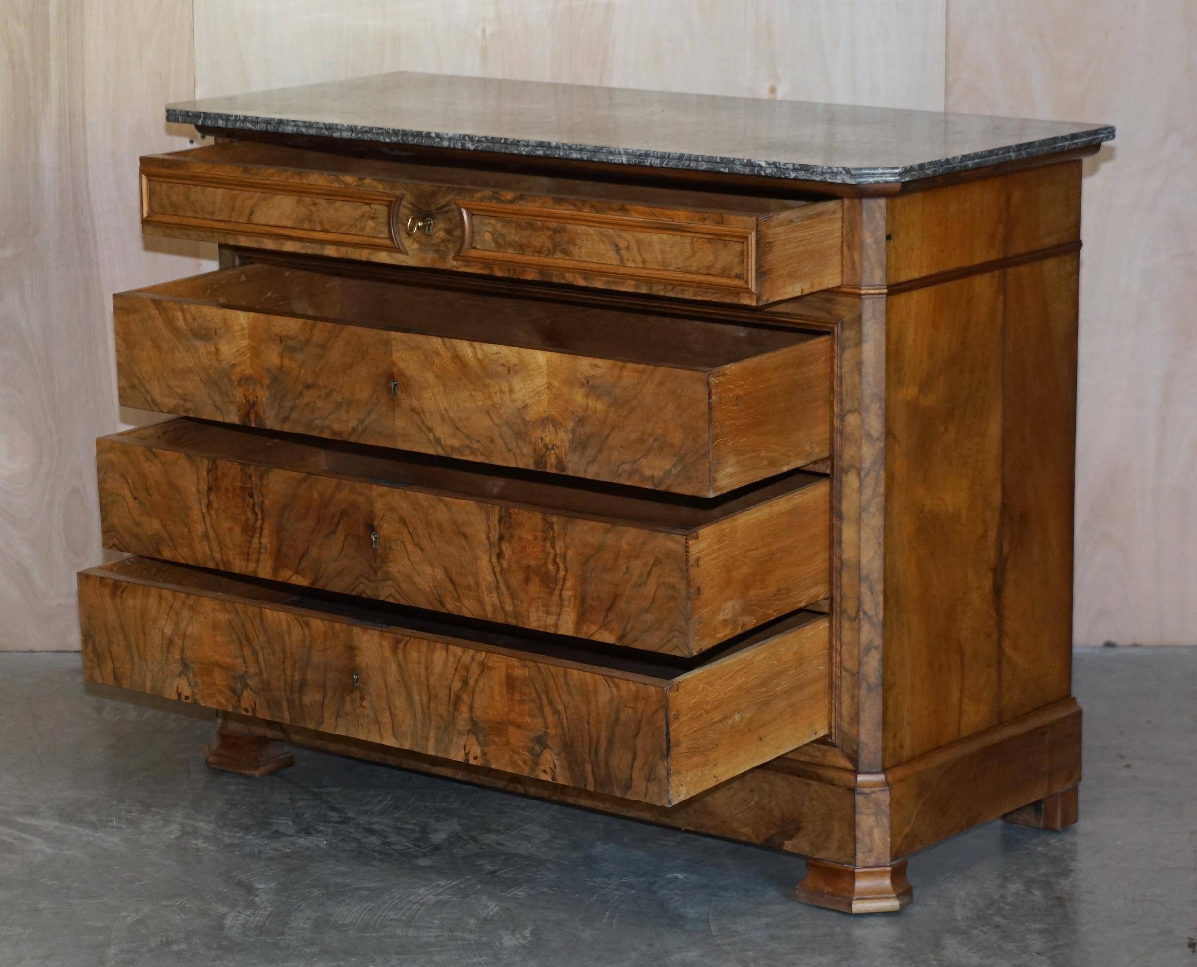 Antique walnut commode from 1860 with a marble top and original key.