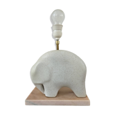 Ceramic lamp base shaped like an elephant.