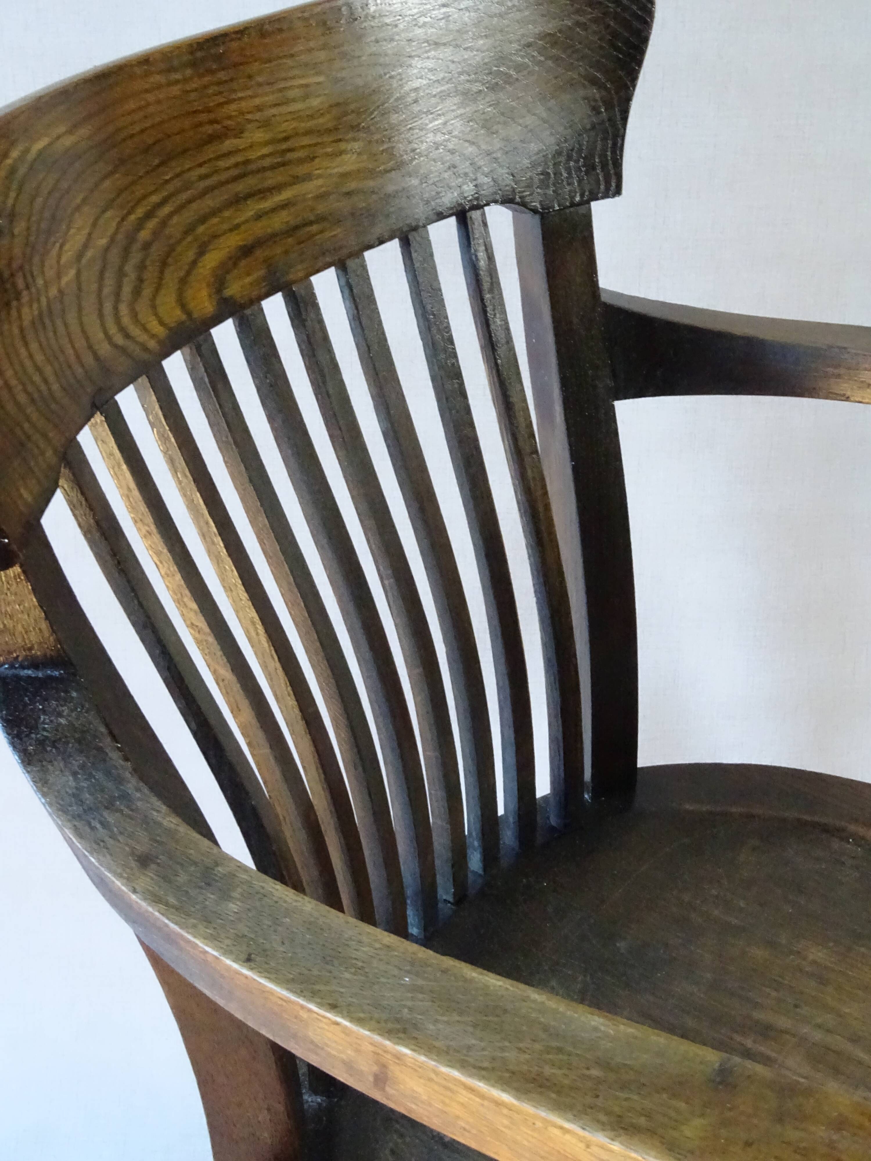 American office armchair with screws, solid oak, 1925/1930