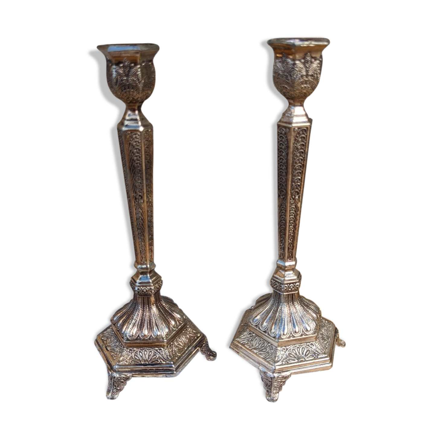 Pair of chiseled metal candle holders