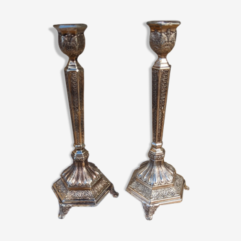 Pair of chiseled metal candle holders