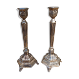 Pair of chiseled metal candle holders